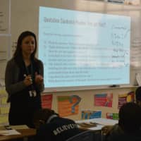 <p>A teacher in training works with a seventh-grade class at Great Oaks Charter School in Bridgeport.</p>