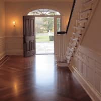 <p>A beautiful foyer awaits guests as they enter the house.</p>