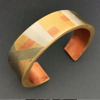 <p>Donuel Roman, age 18, made a bracelet using brass, sterling, copper and nickel silver.</p>