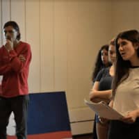 <p>Jesus (Jackie Logsted), Judas (Will Santella), and other cast members at a vocal rehearsal for &quot;Godspell.&quot;</p>