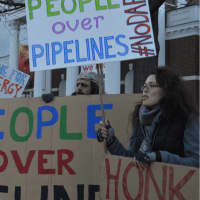 <p>&quot;People Over Pipeline&quot; is one of the signs that marchers hold on Friday afternoon in Stamford.</p>