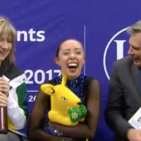 <p>Redding&#x27;s Brooklee Han, center, celebrates with coaches Darlene and Peter Cain after her free skate at the Four Continent Championships.</p>