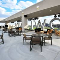 <p>The rooftop terrace at Meadowlands offers views of the track, as well as the New York City skyline.</p>