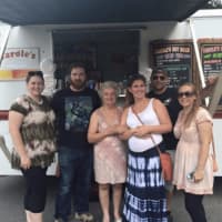 <p>Owner Carole Crusco, 79, center, outside her popular Hyde Park food truck called Carole&#x27;s HotDogs.</p>