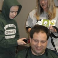 <p>Third-grader Teddy Gerber shaved his dad Bill&#x27;s head at the first-ever St. Baldrick&#x27;s event at Osborn Hill School in 2010.</p>