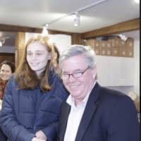 <p>Brookfield First Selectman Steve Dunn presenting Madison Albano of Danbury High School with her second place award for her painting &quot;Fertile Subjugation.&quot;</p>