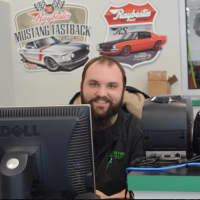 <p>Drew Gleacher is service adviser at Wilton Auto &amp; Tire Center. The business just moved into a building at 658 Danbury Road -- expanding 10 times its size.</p>