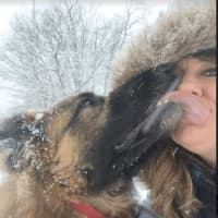 <p>Kristin Wolfe and her 7-year-old dog Zara enjoy Friday&#x27;s snow.</p>