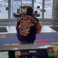 <p>One of two suspects wanted by New Canaan Police for stealing mail Friday is pictured at the TD Bank branch on Friday.</p>