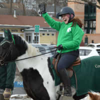 <p>A horseback rider from 13 Hands Equine Rescue participates in Mount Kisco&#x27;s St. Patrick&#x27;s Day parade.</p>