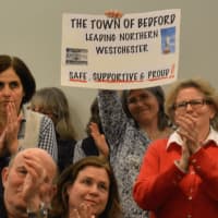<p>Residents give applause after the Bedford Town Board adopted a resolution on immigration policy.</p>