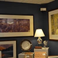 <p>Framed art lines walls at Artists&#x27; Market, a haven for collectors and enthusiasts in Norwalk.</p>