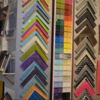 <p>Frames galore line the walls at Artists&#x27; Market in Norwalk</p>