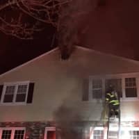 <p>Greenwich firefighters battling a blaze on Riverdale Avenue home early Friday.</p>