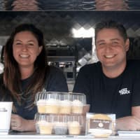 <p>Jessica and Alex Grutkowski of Fairfield own The Buzz Truck, a 4-year-old Fairfield-based company that operates out of a small black school bus.</p>