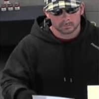 <p>A surveillance photo of the suspect in the robbery at the Webster Bank in Milford on March 23.</p>