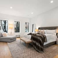 <p>The bedrooms take a clean, minimalist approach.</p>