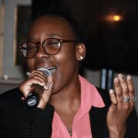 <p>Gabrielle Pierre-Louis, a Carver alumna now studying to be a dentist at the University of Bridgeport, performs at the fundraiser.</p>