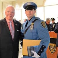 <p>New Rochelle Police Commissioner Patrick Carroll with Police Officer of the year Nicholas Zuzulo.</p>