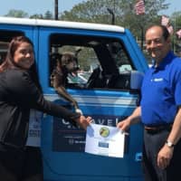 <p>Opal the pit bull mix and her owner, Chelsea Massimin of Danbury, accept first place honors in the Westport Dog Festival&#x27;s Fastest Dog competition from race sponsor Paul Garavel of Garavel Auto Group.</p>