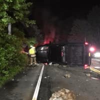 <p>South Salem firefighters work a single-vehicle crash Tuesday on Route 35.</p>