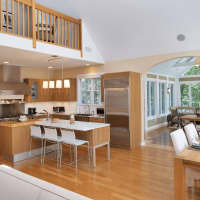 <p>Inside, the home&#x27;s open floor plan contains lofted ceilings and a state-of-the-art kitchen.</p>