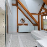 <p>The lake is visible from most rooms in the house. The master bathroom features a tub, spa shower and incredible vistas.</p>