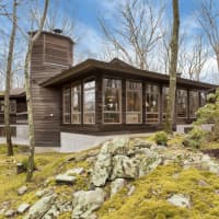 <p>Designed in the style of Frank Loyd Wright, 542 Pound Ridge Road in Bedford is a modern take on the traditional cabin.</p>