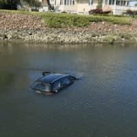 <p>A car plunged into Pine Creek in Fairfield on Friday.</p>