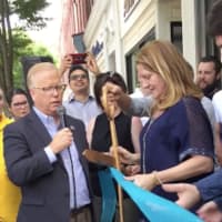 <p>Mayor Mark Boughton and owner Andrea Gartner cut the ribbon Thursday at the new Pour Me Coffee &amp; Wine Cafe in Danbury.</p>