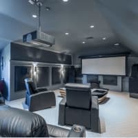 <p>The house&#x27;s theater room offers owners the chance to relax, unwind and enjoy a movie, television or big game.</p>