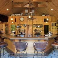 <p>Designed with nature lovers in mind, the house&#x27;s outdoor kitchen and bar are perfect for enjoying the summer heat.</p>