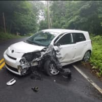 <p>This white Scion was traveling too fast around the sharp bend on West Carlton Road and crossed over the center, double-yellow lines, where it struck a gray Honda, police said.</p>