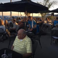 <p>The sun sets on another busy evening at the Crabby Dog Tavern.</p>