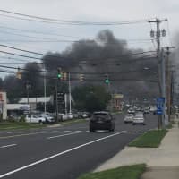 <p>The smoky fire late Tuesday afternoon at a junkyard could be seen for miles in the Milford area.</p>