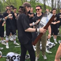 <p>Harrison Mauldin was able to leave the hospital to attend the final Bard College lacrosse game of the season. He joins the team on the field, where he was presented with a mounted, framed No. 34 jersey, which he wore in his two years on the team.</p>