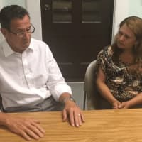<p>Gov. Dannel Malloy meets with Nury Chavarria at Iglesia De Dios Pentecostal church in New Haven on Thursday. Chavarria took refuge in the church after she was ordered to be deported.</p>