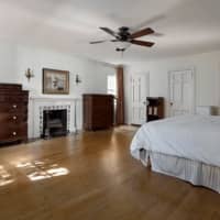 <p>The master bedroom features hardwood floors and a spacious layout.</p>