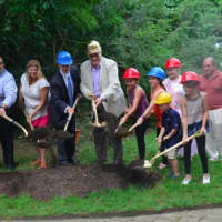 <p>Local dignitaries and zoo lovers break ground on a new red panda exhibit at Beardsley Zoo as Director Gregg Dancho, right, looks on.</p>