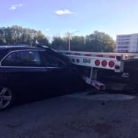 <p>A sedan slammed into the back of the flatbed of a tractor-trailer that was parked near the Exit 2 on ramp of I-84 eastbound during the Friday morning rush hour.</p>