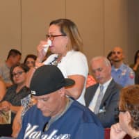 <p>Bridgeport mayoral aide Alma Maya dabs away tears as she speaks of the destruction in Puerto Rico.</p>