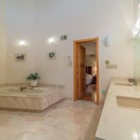 <p>The master bathroom features a shower and built-in tub.</p>