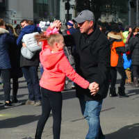 <p>Rich Askintowicz dances with his daughter, Keira, at the Stamford Downtown Parade Spectacular.</p>