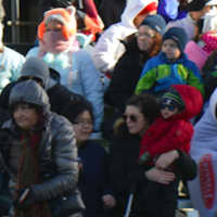 <p>Parade fans bundled up against the cold winds.</p>