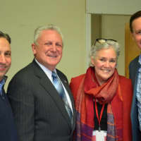 <p>Ceci Maher, center, the executive director of Person-To-Person, is joined by, from left, State Sen. Bob Duff, Norwalk Mayor Harry Rilling and U.S. Sen. Chris Murphy as they hand out Thanksgiving food bags on Wednesday.</p>