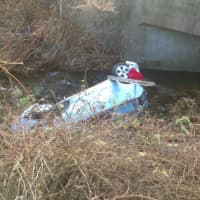 <p>A car rolled down an embankment off Exit 7 of I-84 eastbound in Danbury on Wednesday morning.</p>