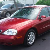 <p>The two may be traveling in a red Mercury Sable with Florida tag Z04CSC, similar to this one.</p>