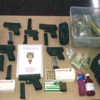 <p>A search of a &#x27;stash house&#x27; on Fourth Street turned up over 2 pounds of marijuana, packaging material, scales, ecstasy pills, cough syrup known as “lean,” U.S. currency and six illegal firearms, Bridgeport police said.</p>