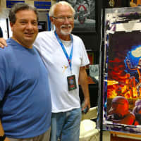 <p>West Nyack&#x27;s Scott Gunther with world-renowned artist Greg Hildebrandt and his new acrylic painting.</p>