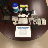 <p>Over a half-kilo of heroin and 160 grams of cocaine were seized, along with drug-packaging materials, Stratford police said.</p>